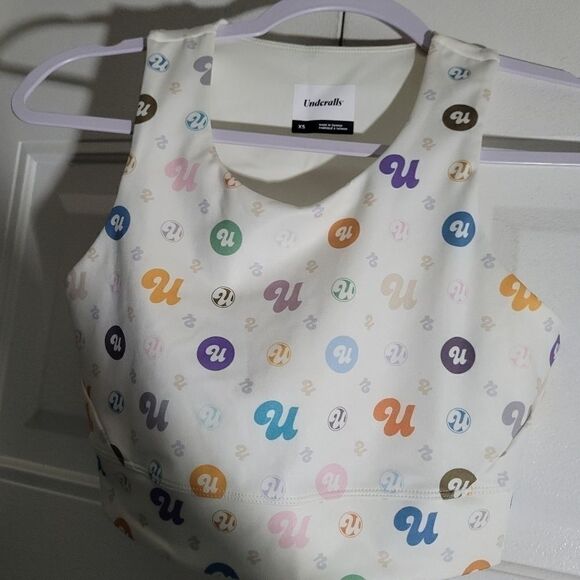 UNDERALLS white with logo design on it Nwot size Xsmall Cream sports bra Nwot - Picture 1 of 5